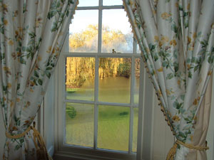 flower-pattern window draperies with tiebacks